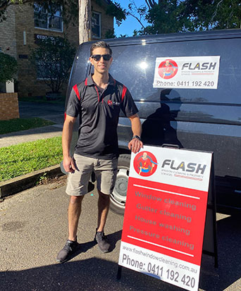 Photo of flash window cleaning and property services franchisee immaculately cleaning windows and cleaning the home of a property in the Hills District