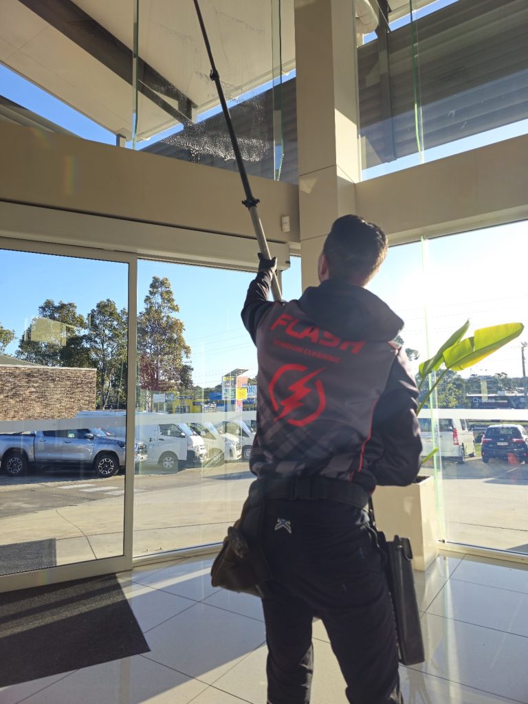 Photo of flash window cleaning and property services franchisee immaculately cleaning windows and cleaning the home of a property in St George area